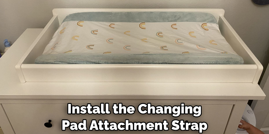 Install the Changing Pad Attachment Strap