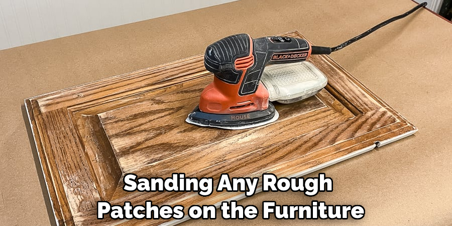 Sanding Any Rough Patches on the Furniture