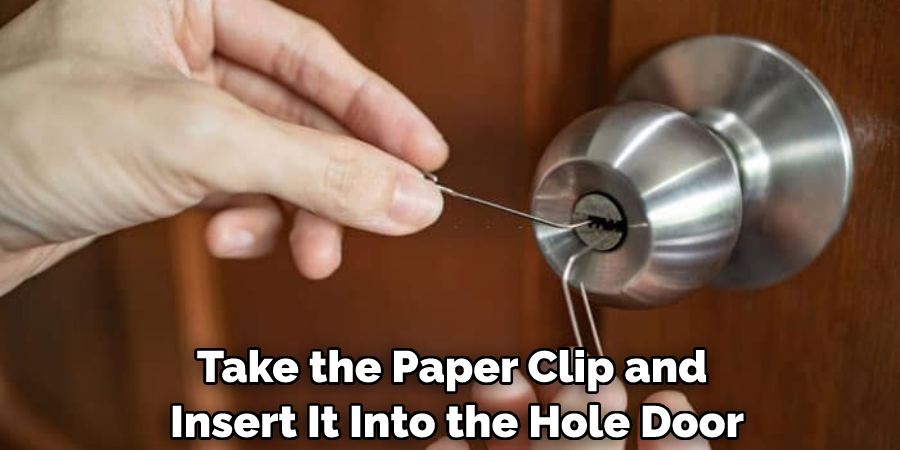 Take the Paper Clip and Insert It Into the Hole Door