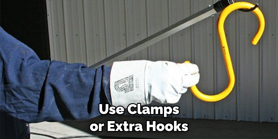 Use Clamps or Extra Hooks