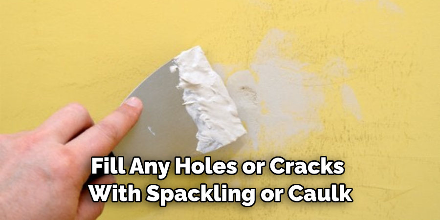 Fill Any Holes or Cracks With Spackling or Caulk