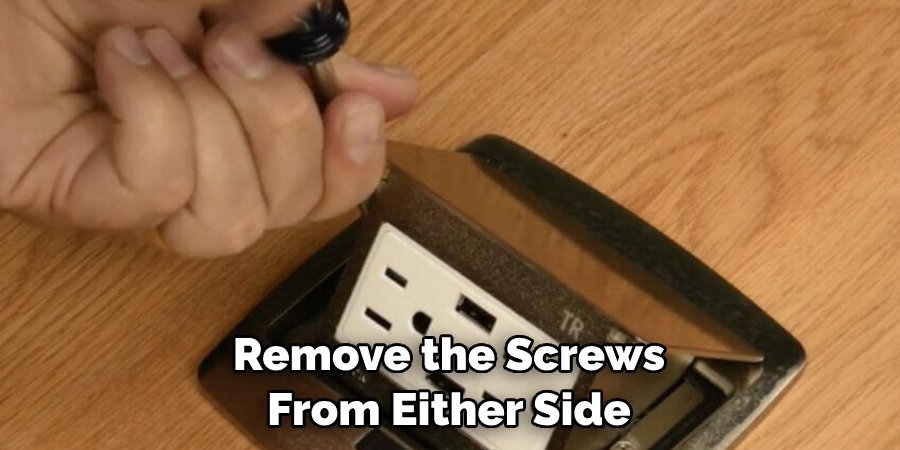 Remove the Screws From Either Side 