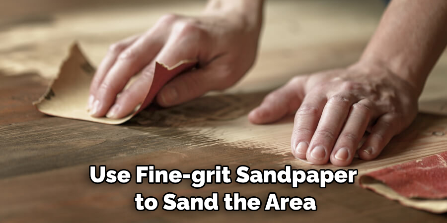 Use Fine-grit Sandpaper to Sand the Area