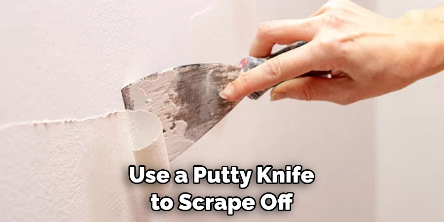  Use a Putty Knife to Scrape Off