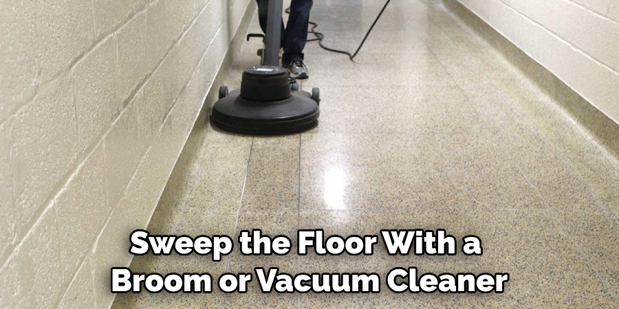 Sweep the Floor With a Broom or Vacuum Cleaner