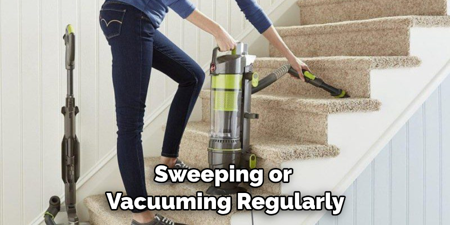 Sweeping or Vacuuming Regularly