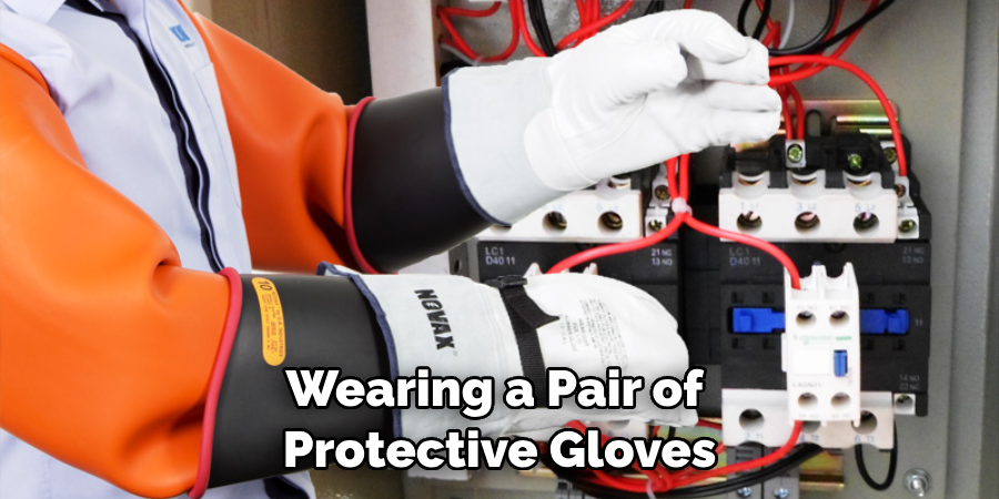 Wearing a Pair of Protective Gloves