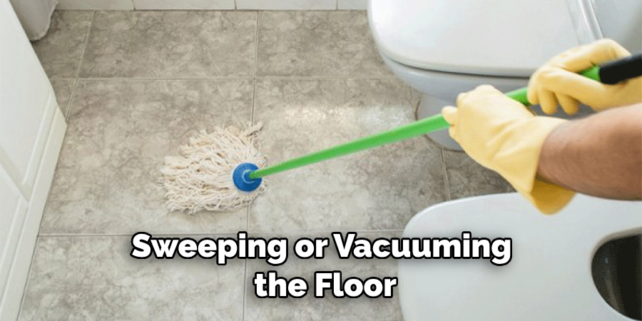 sweeping or vacuuming the floor