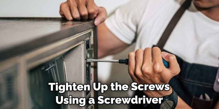 Tighten Up the Screws Using a Screwdriver