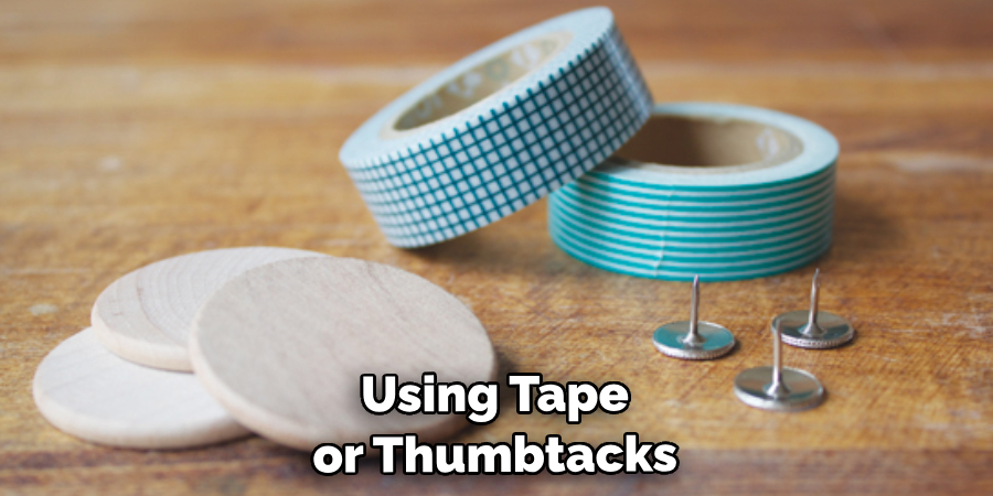 Using Tape or Thumbtacksc