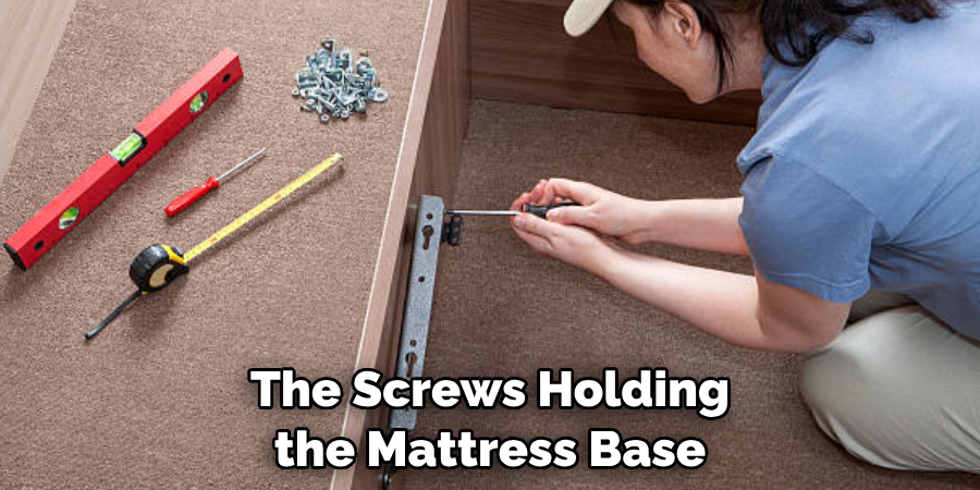 The Screws Holding the Mattress Base