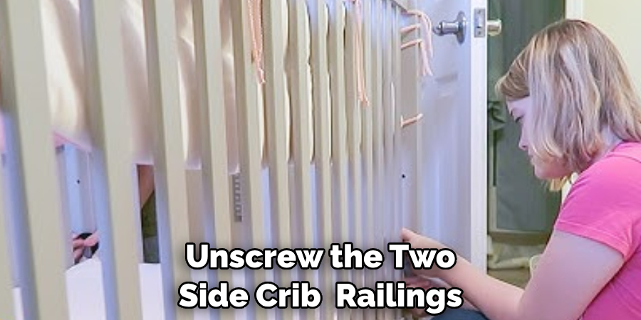 Unscrew the Two Side Crib  Railings