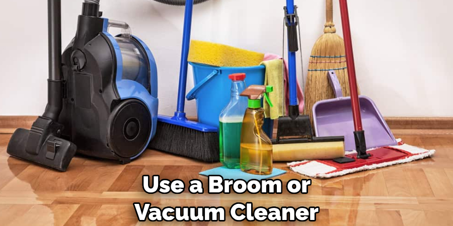 Use a Broom or Vacuum Cleaner