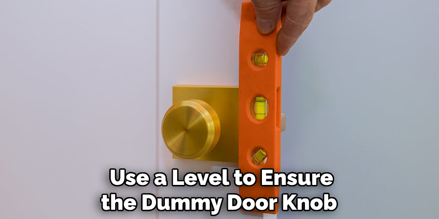 Use a Level to Ensure the Dummy Door Knob 