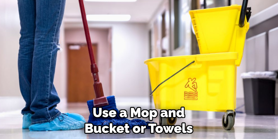 Use a Mop and Bucket or Towels