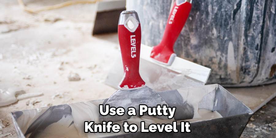 Use a Putty Knife to Level It