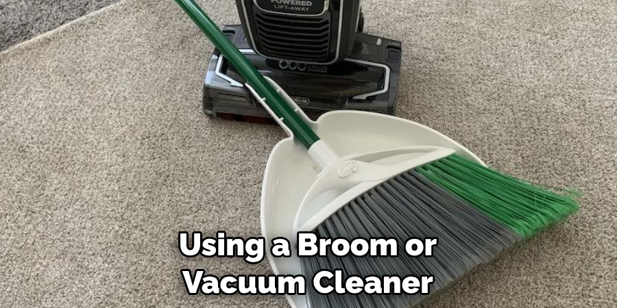 Using a Broom or Vacuum Cleaner