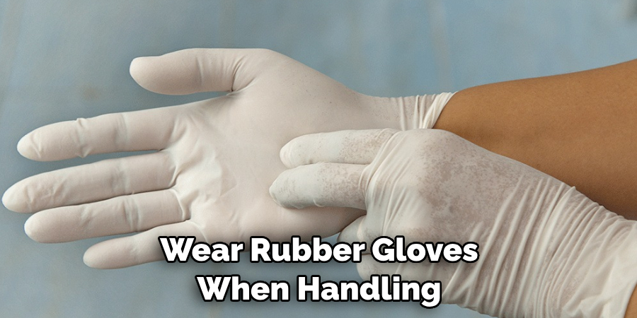 Wear Rubber Gloves When Handling