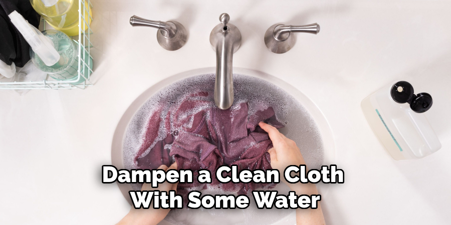 Dampen a Clean Cloth With Some Water