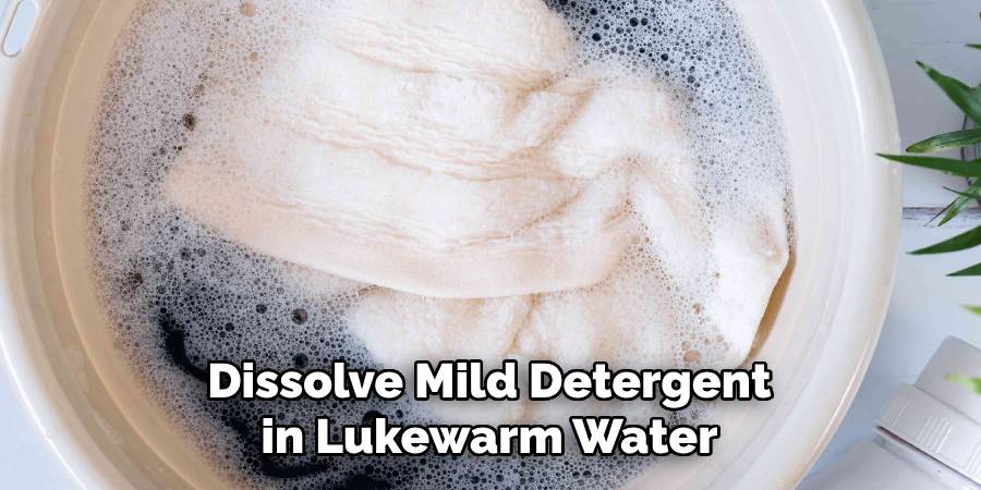 Dissolve Mild Detergent in Lukewarm Water