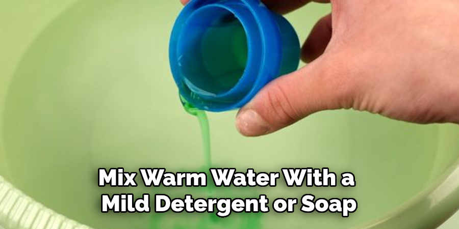 Mix Warm Water With a Mild Detergent or Soap