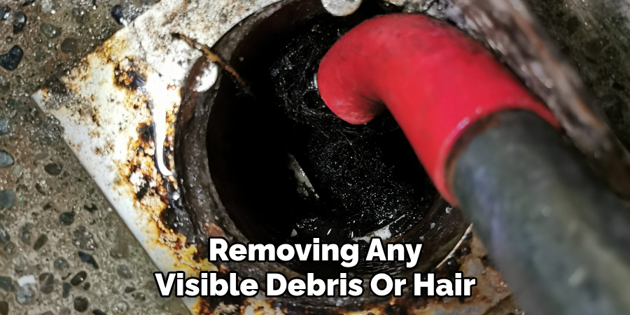 Removing Any Visible Debris Or Hair