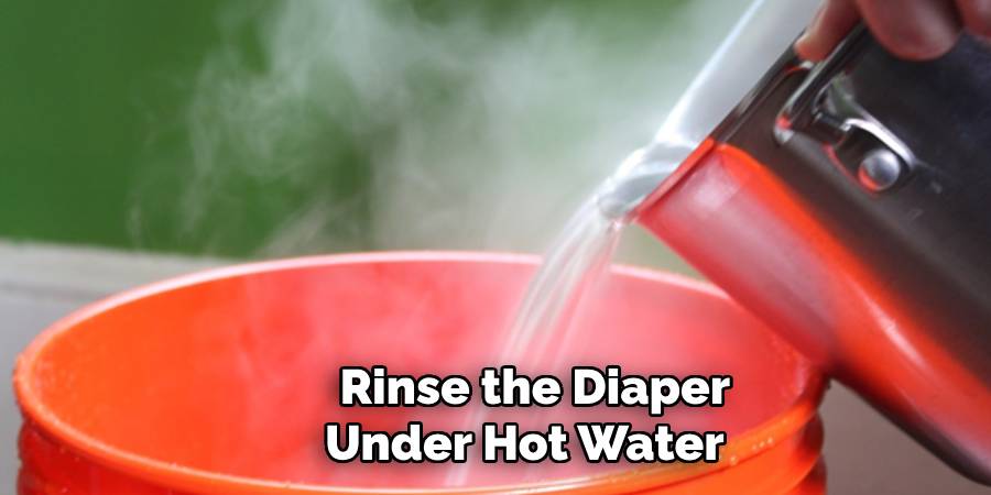  Rinse the Diaper Under Hot Water 