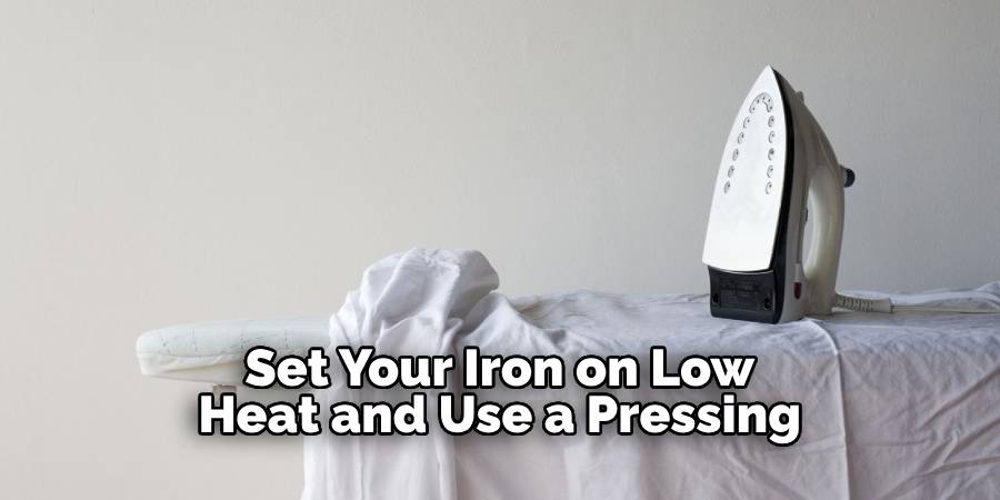 Set Your Iron on Low Heat and Use a Pressing