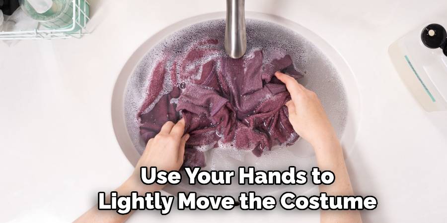 Use Your Hands to Lightly Move the Costume