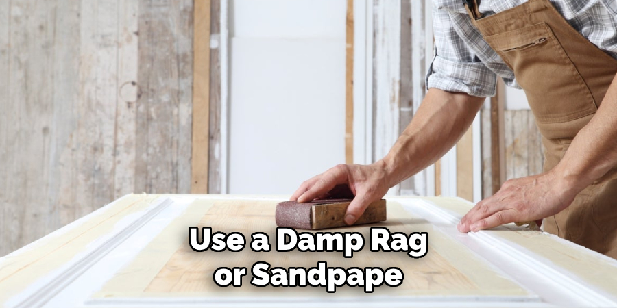Use a Damp Rag or Sandpape