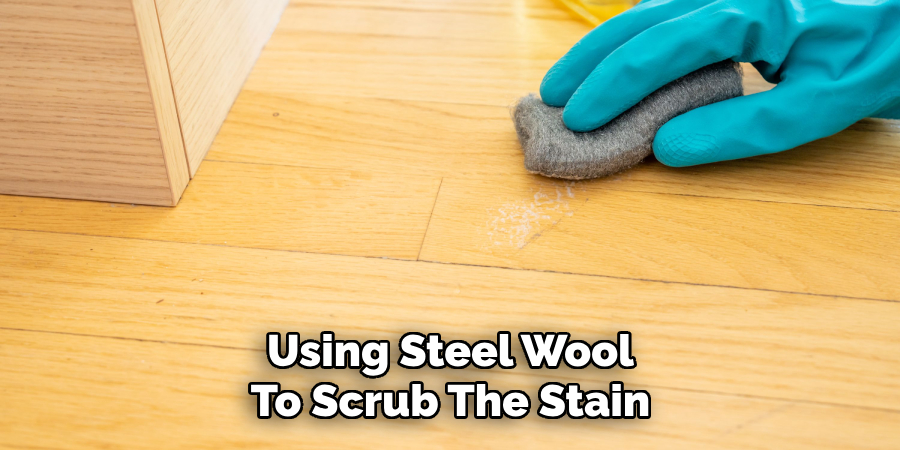 Using Steel Wool To Scrub The Stain