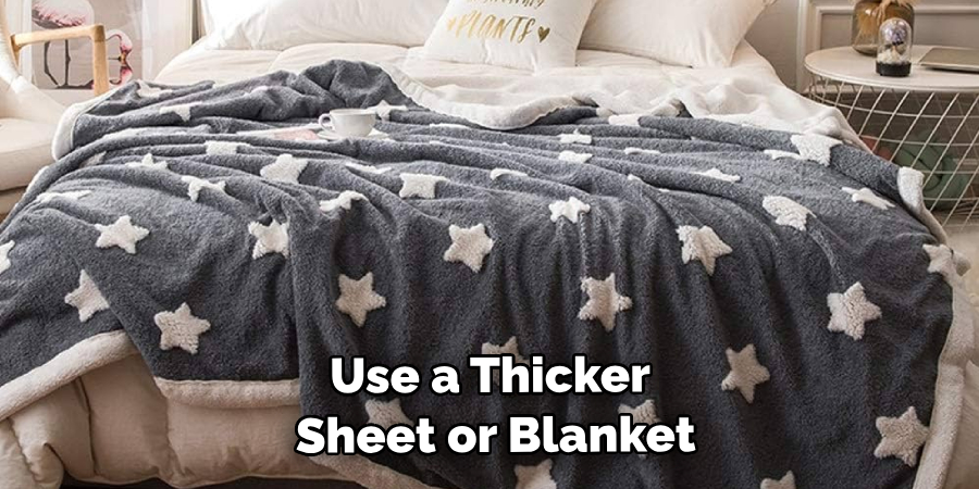 Use a Thicker Sheet or Blanket