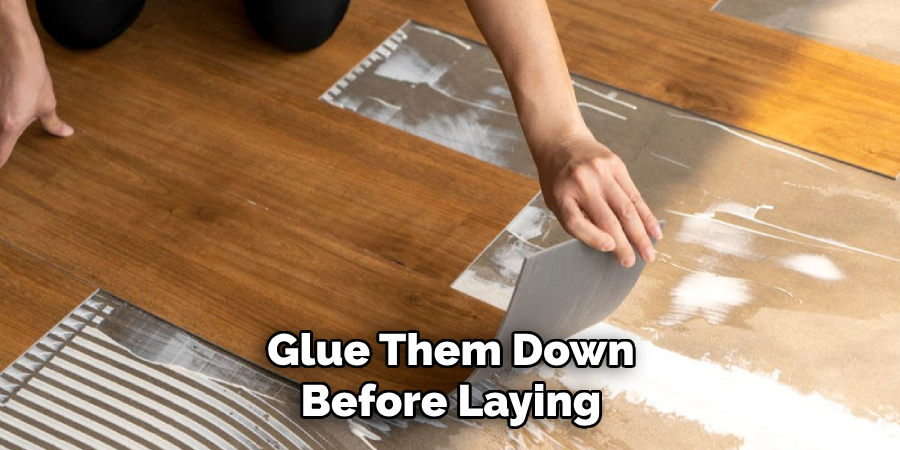 Glue Them Down Before Laying