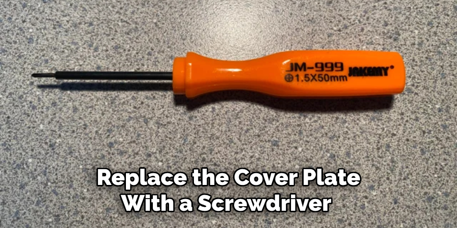 Replace the Cover Plate With a Screwdriver 