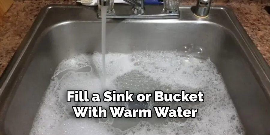 Fill a Sink or Bucket With Warm Water