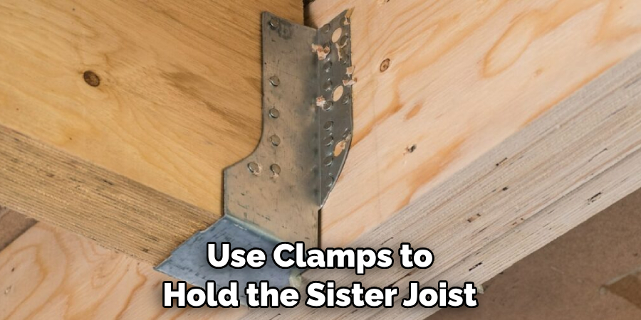 Use Clamps to Hold the Sister Joist
