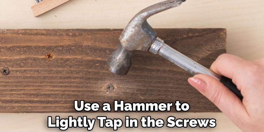 Use a Hammer to Lightly Tap in the Screws
