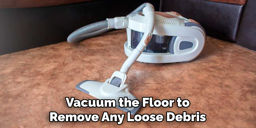 Vacuum the Floor to Remove Any Loose Debris