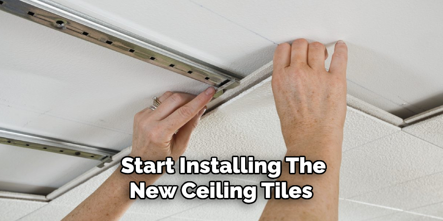Start Installing the New Ceiling Tiles
