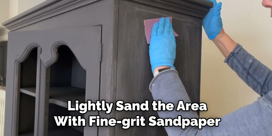 Lightly Sand the Area With Fine-grit Sandpaper