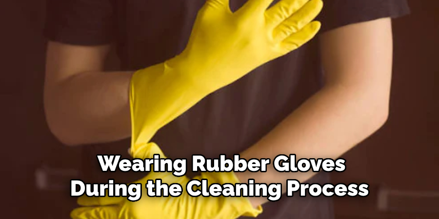 Wearing Rubber Gloves During the Cleaning Process