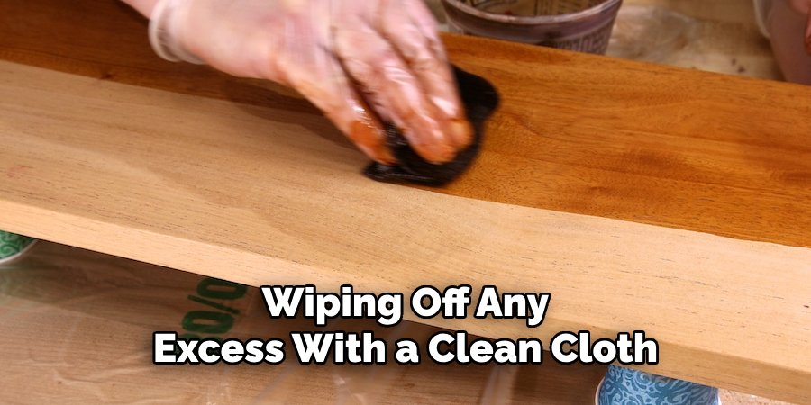 Wiping Off Any Excess With a Clean Cloth