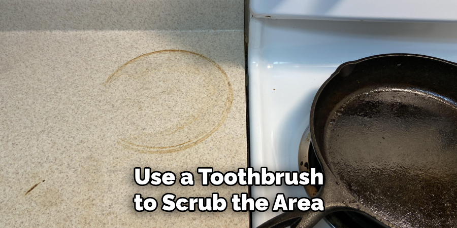 Use a Toothbrush to Scrub the Area