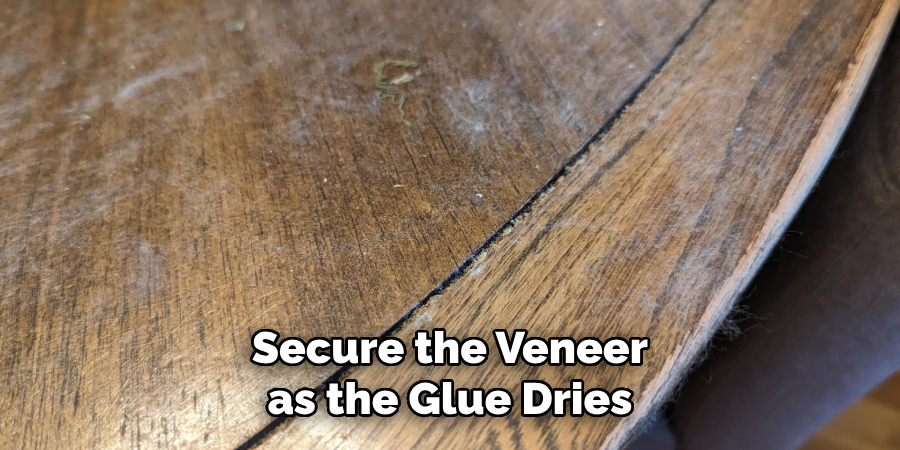 Secure the Veneer as the Glue Dries