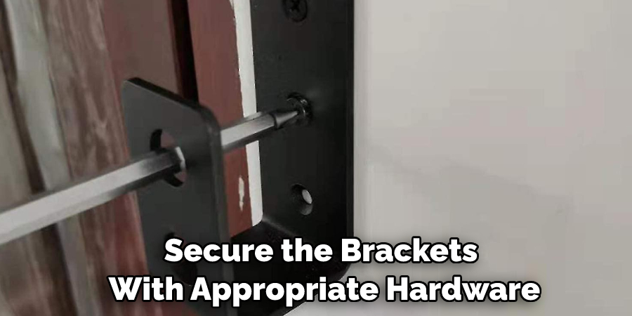 Secure the brackets with appropriate hardware