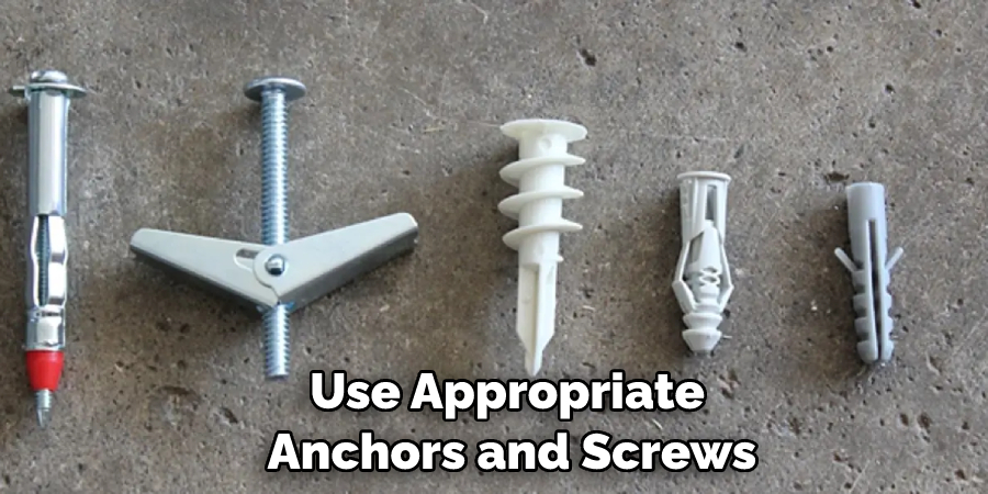 using appropriate anchors and screws