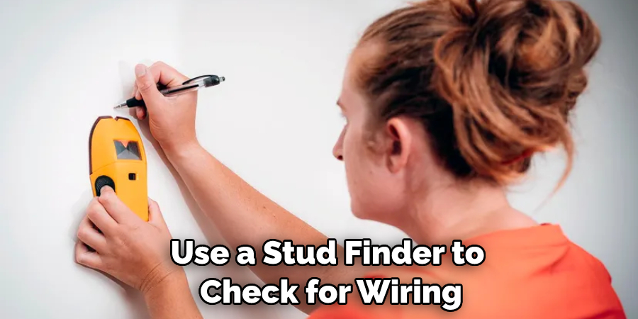 use a stud finder to check for wiring