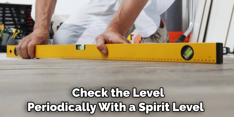  Check the Level Periodically With a Spirit Level