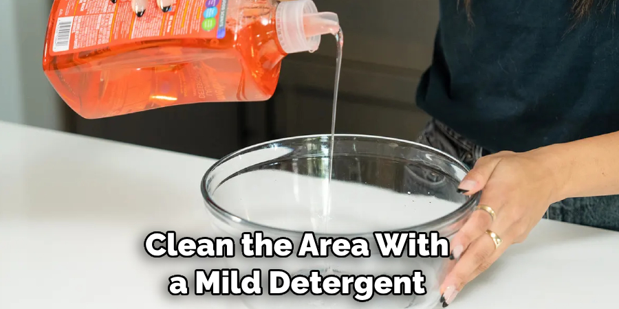 Clean the Area With a Mild Detergent