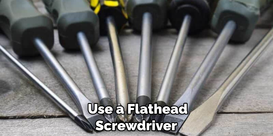  Use a Flathead Screwdriver